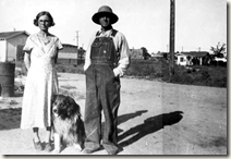 Thomas Russell, Minister of the Pentecostal Church, with his wife and dog (it is uncertain whether the town in the background is actually Dearfield or another community he also served)