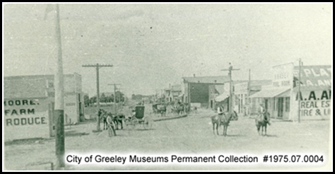 1914 – Downtown Kersey looking North; Look on top of left-center phone pole and see a man installing the first lines in Kersey for Mountain States Telephone